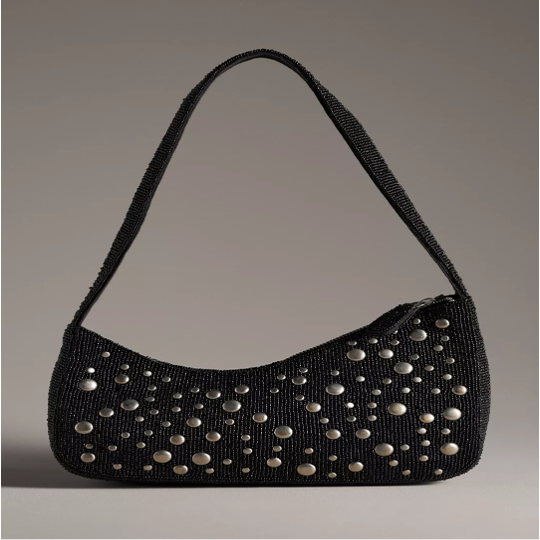 A black, studded bag with a grey background