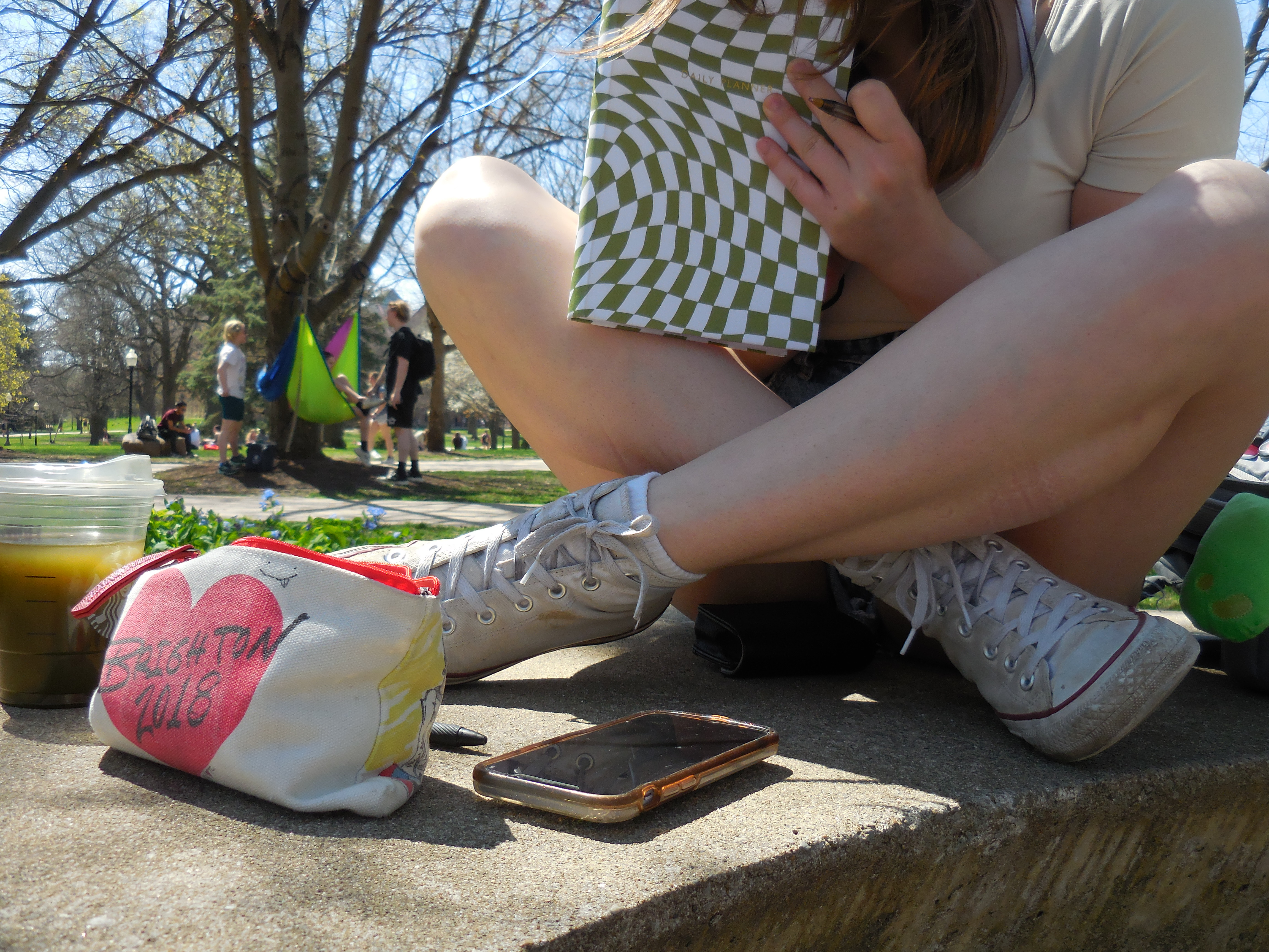 Girl sitting outside with a journal