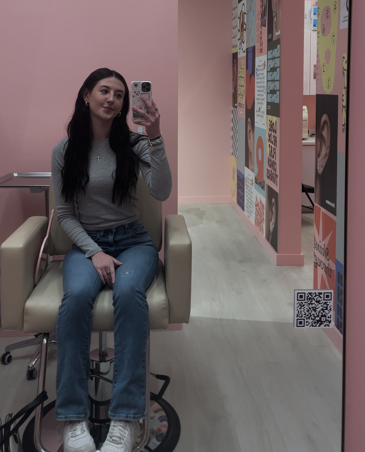 Girl sitting in piercing chair