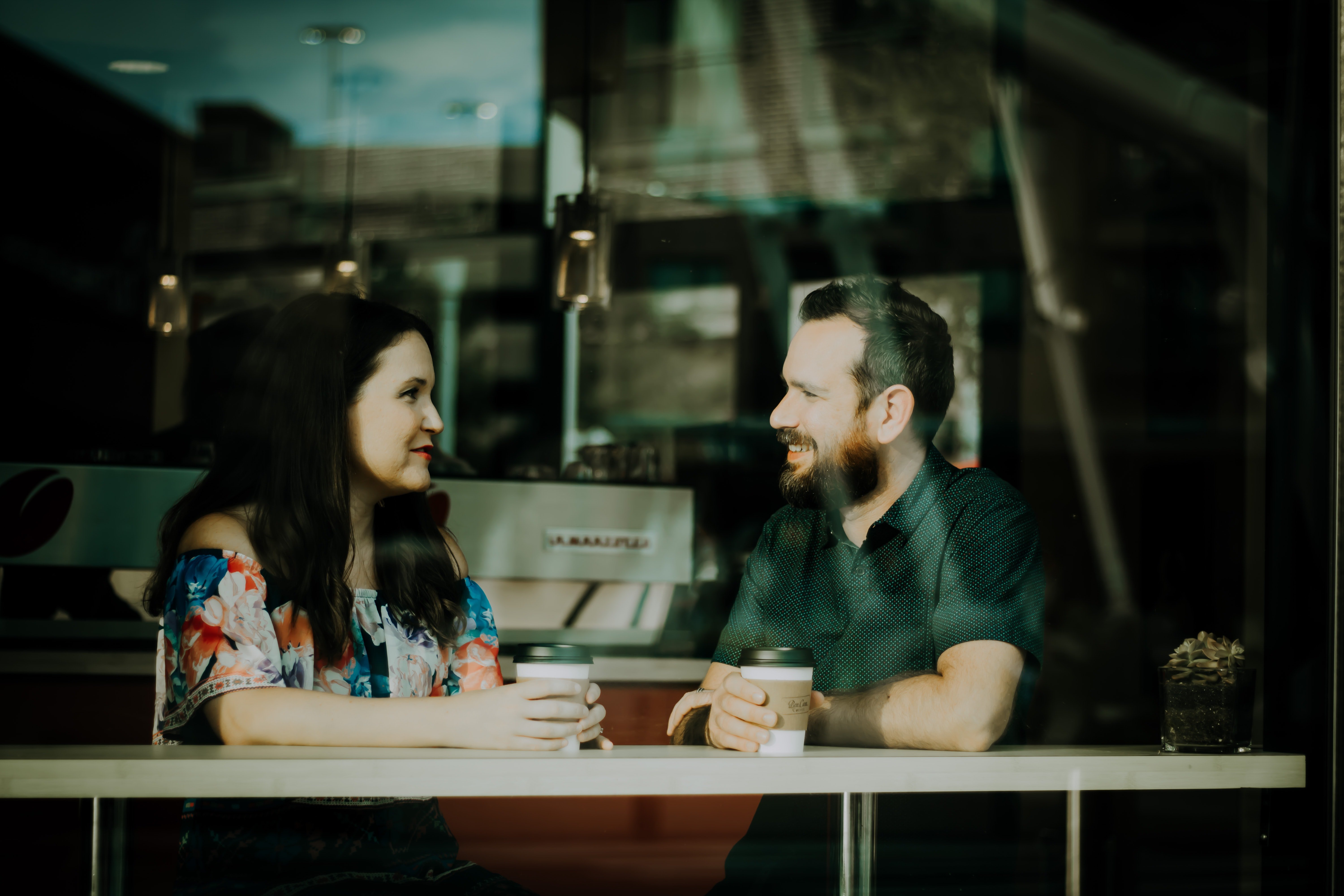 Couple talking with coffee