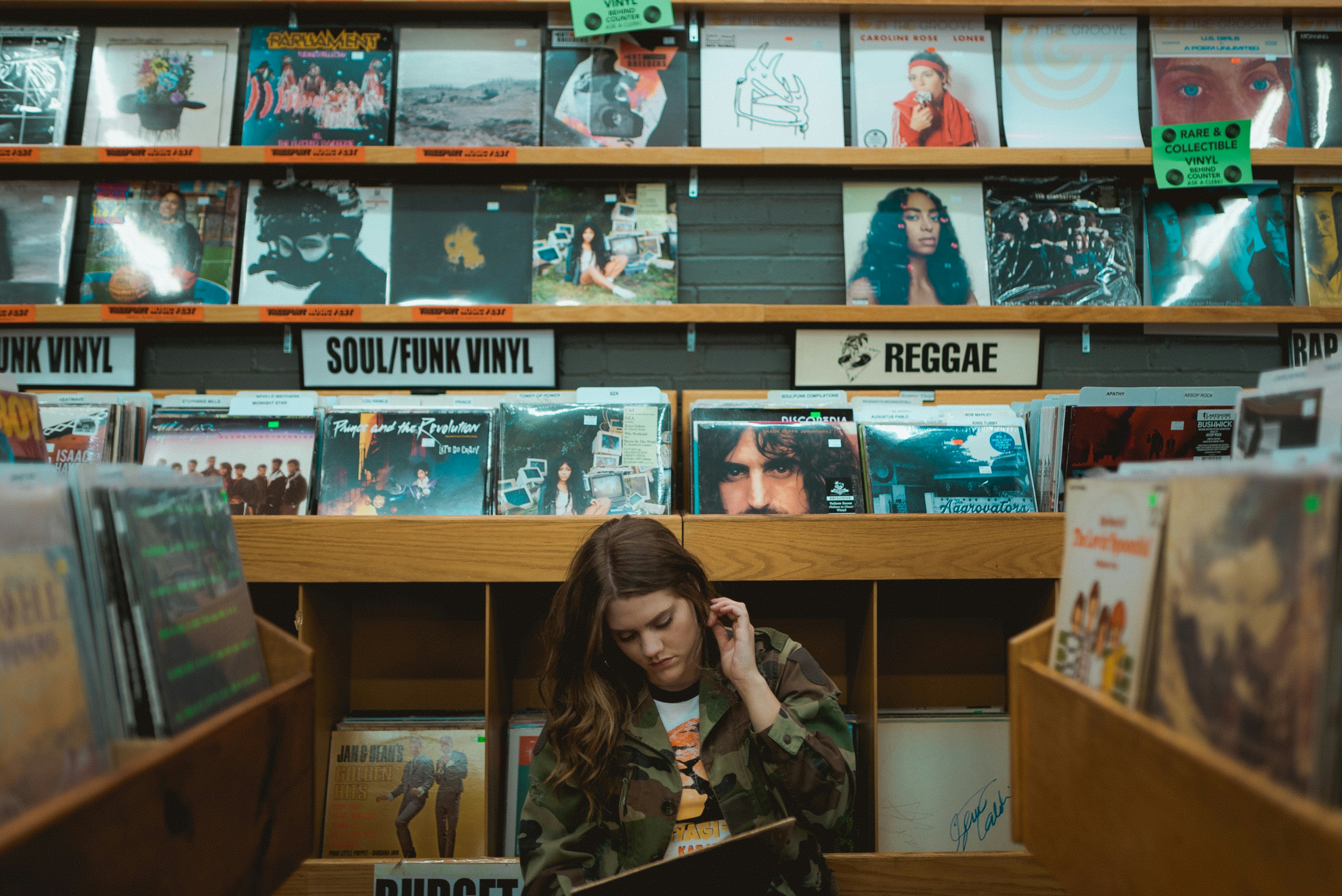 woman sitting in record store