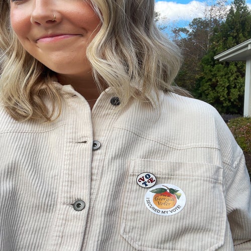 woman with a voting sticker