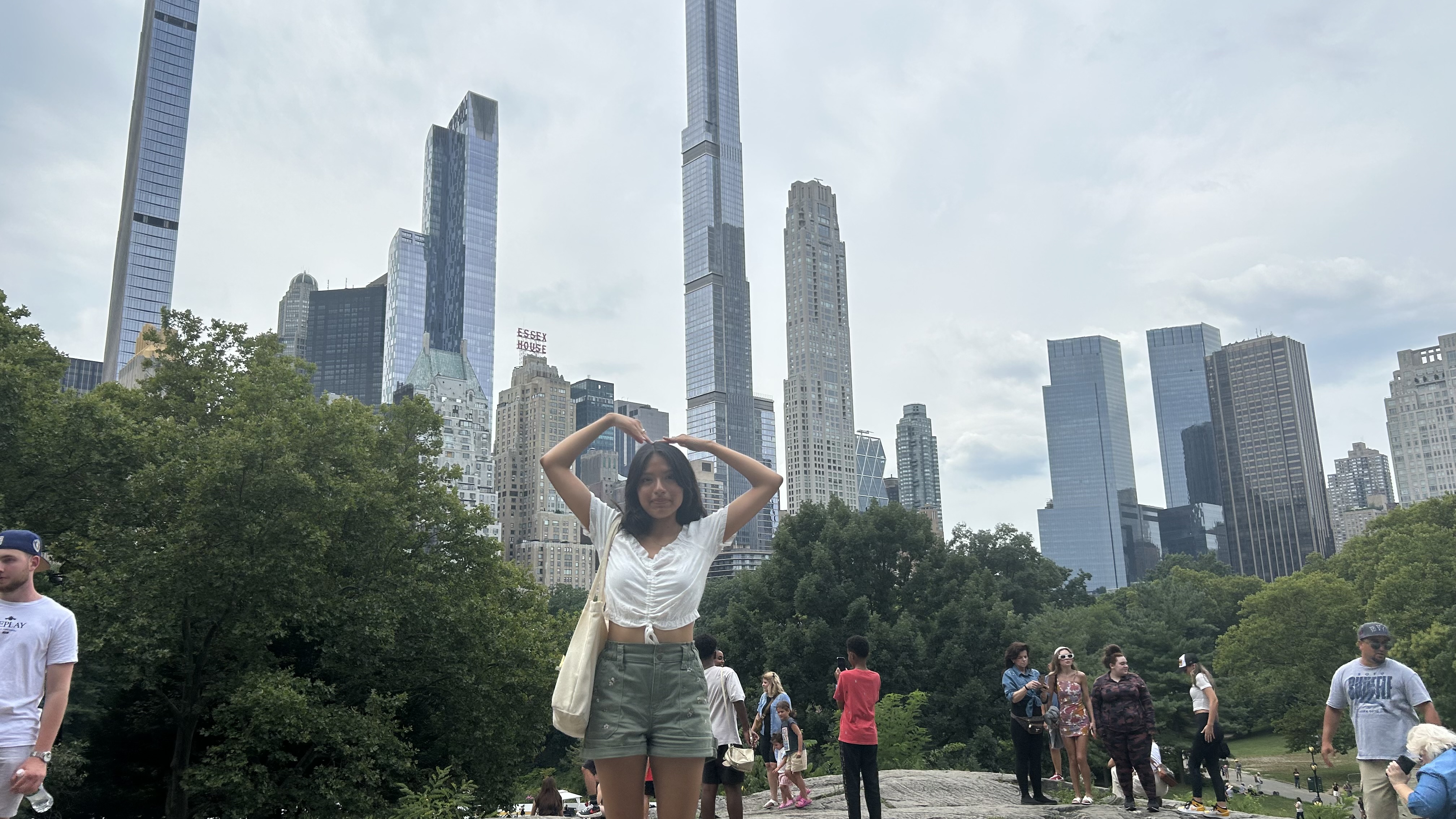 woman (me) at central park with buildings in the background
