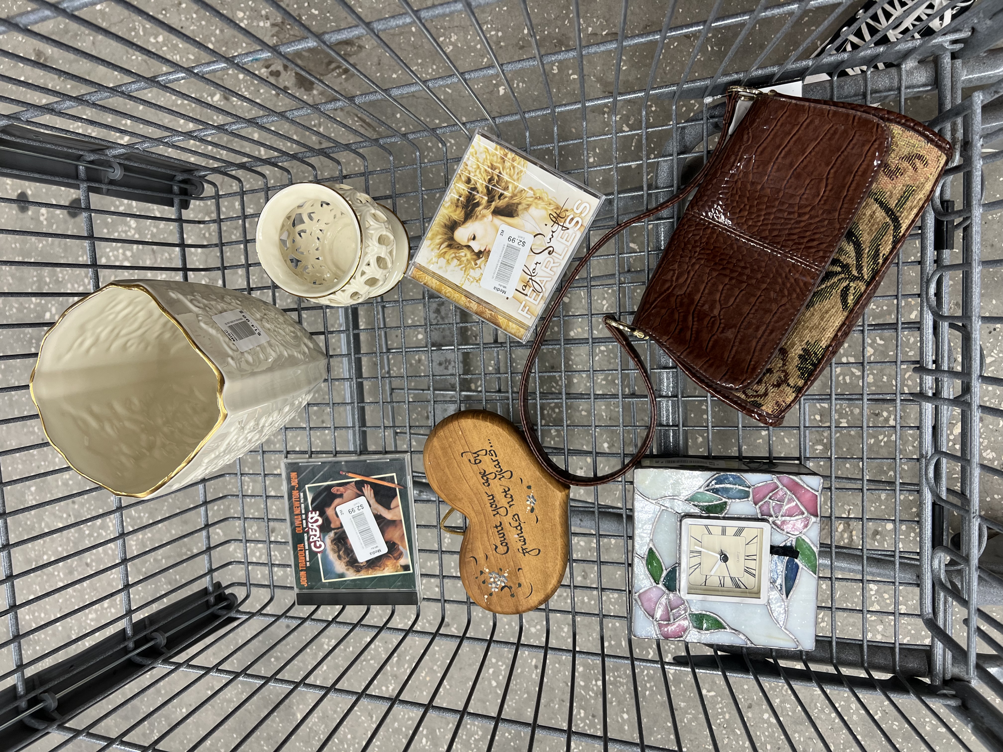 Shopping cart full of thrifted items