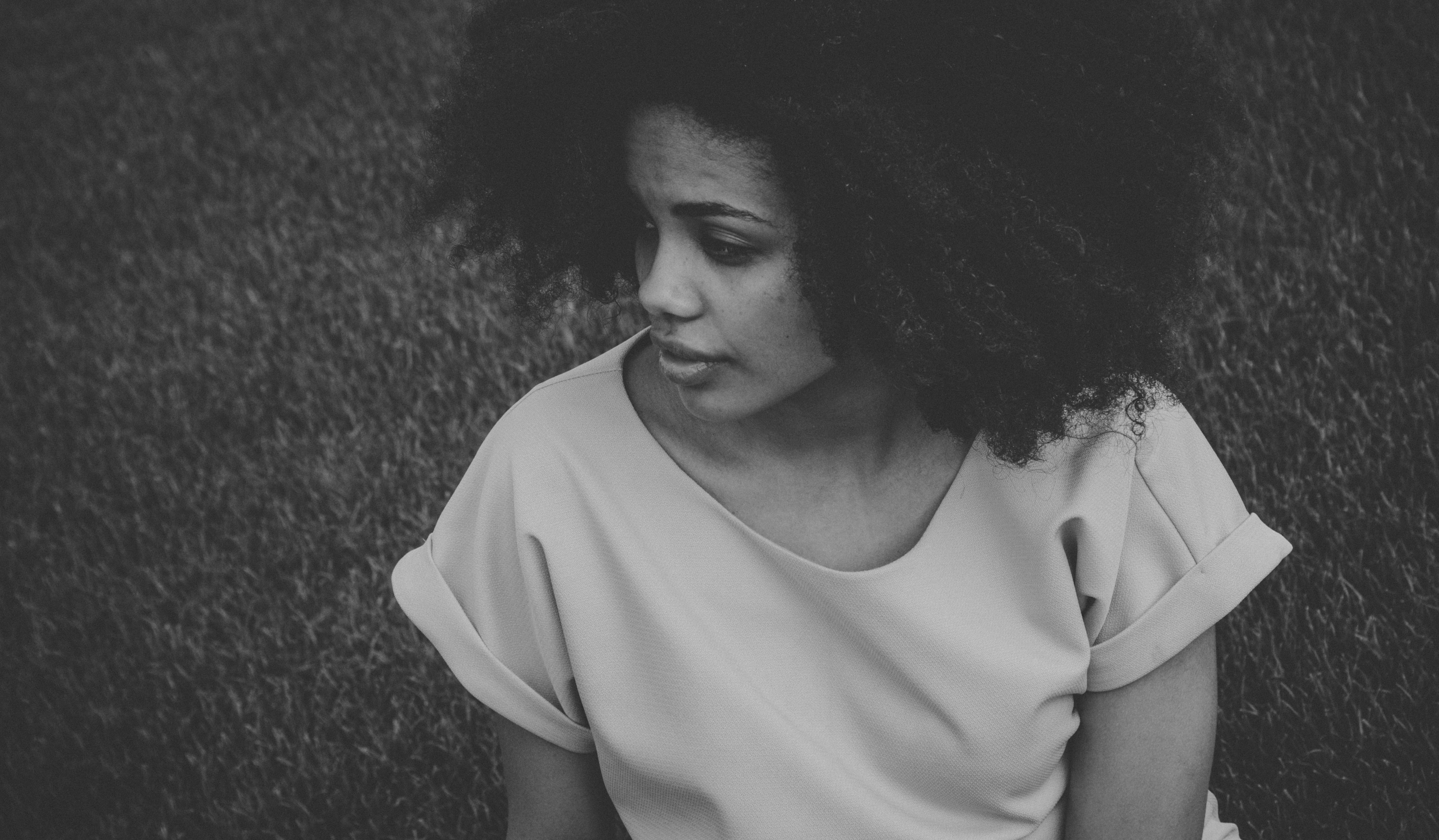 girl in black and white with curly hair