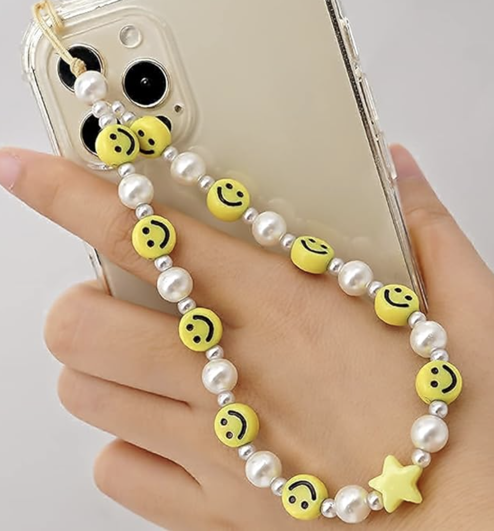 phone charm with yellow smiley faces