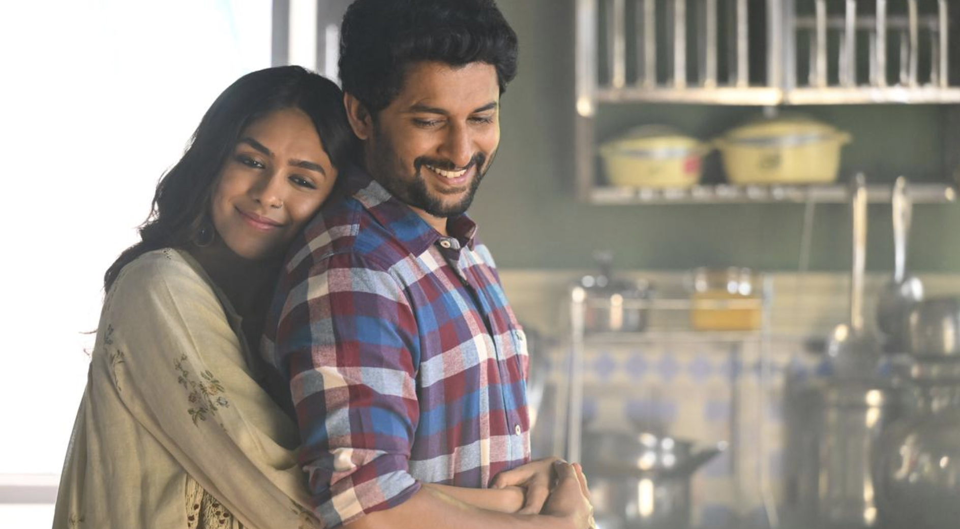 Two people hugging for a movie wallpaper.