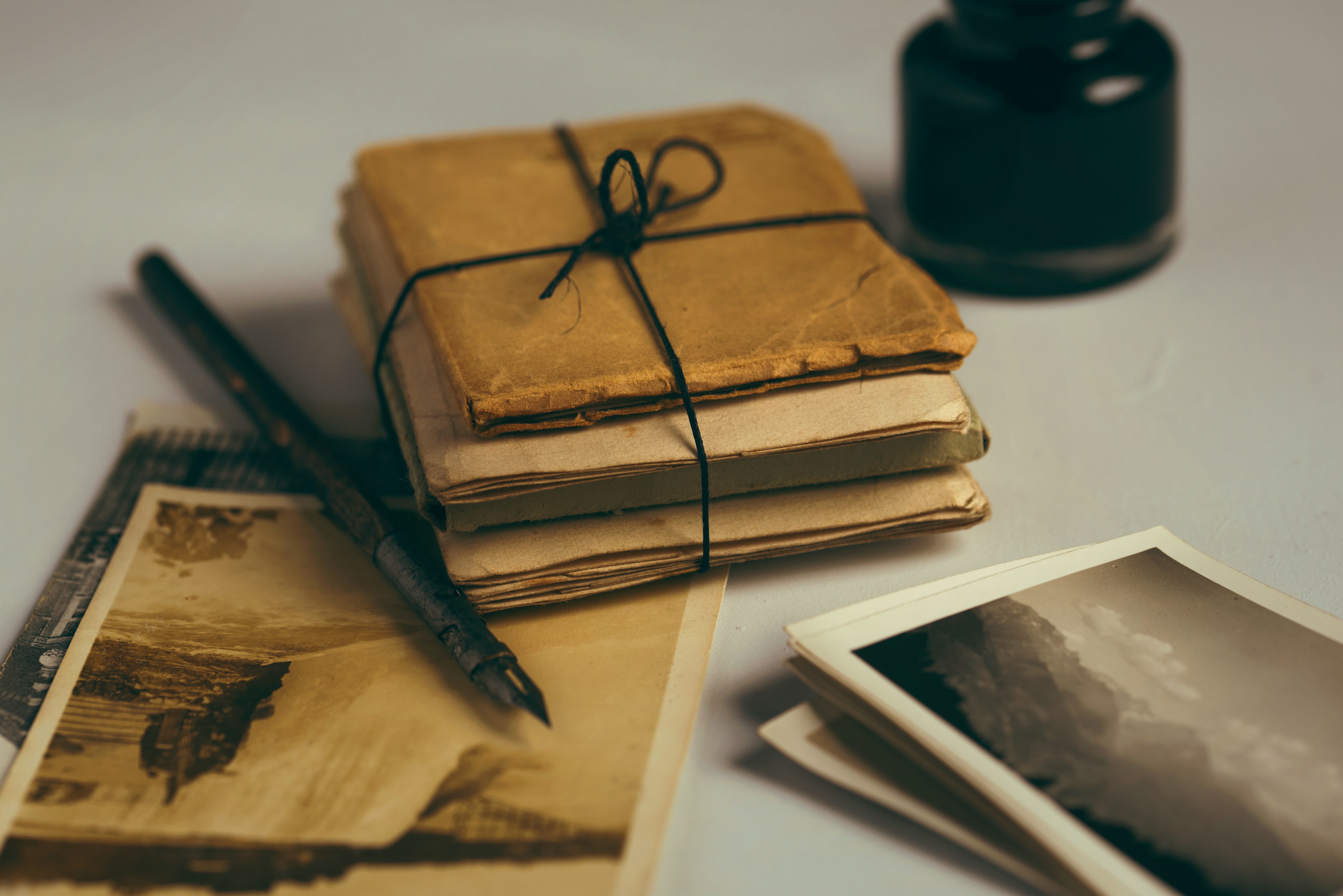 Photographs and letters wrapped together with an ink pen.