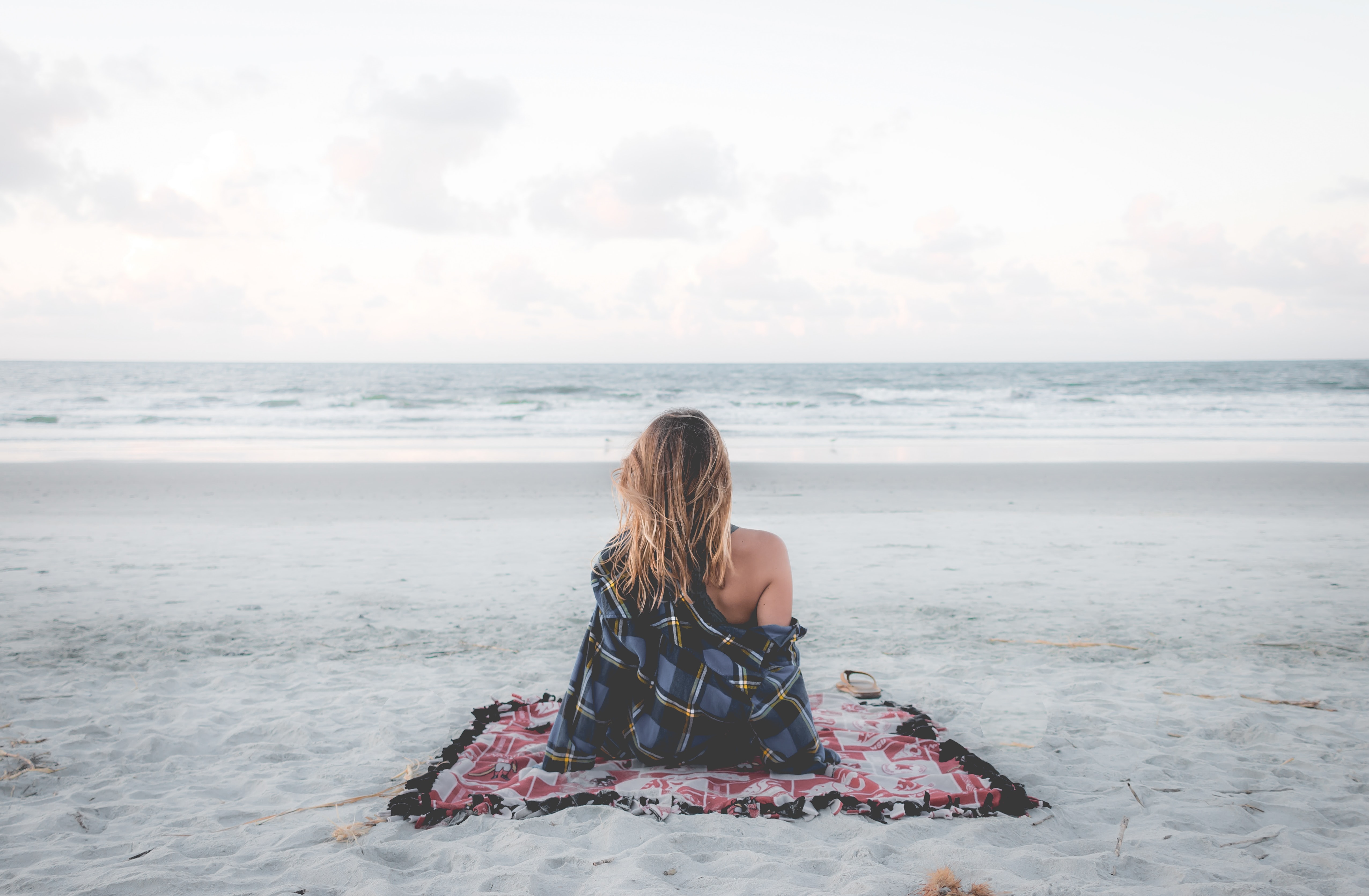 Woman sitting alone on beach by Cody Black on Unsplash?width=698&height=466&fit=crop&auto=webp&dpr=4