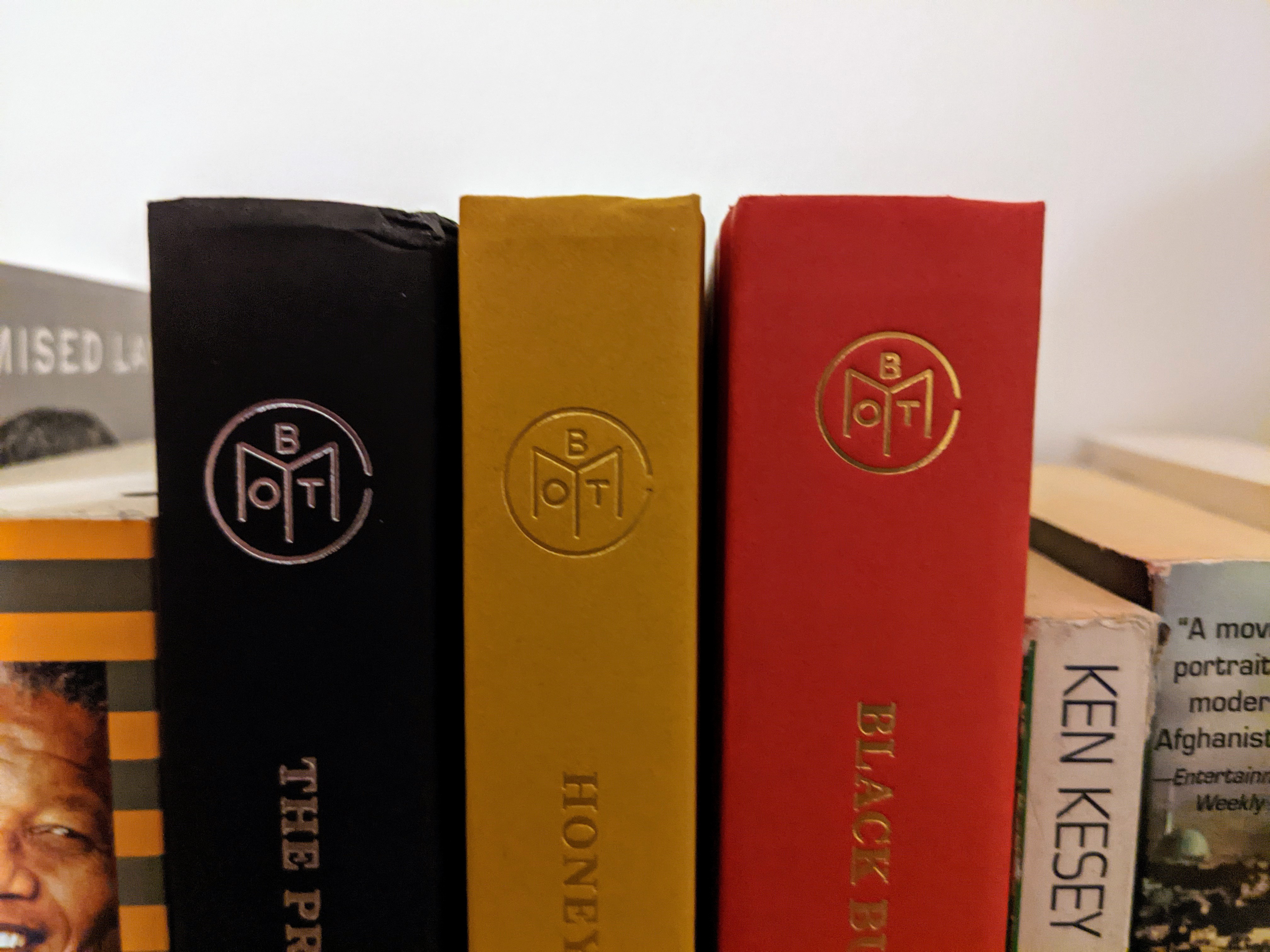 Book of the Month books surrounded by other books