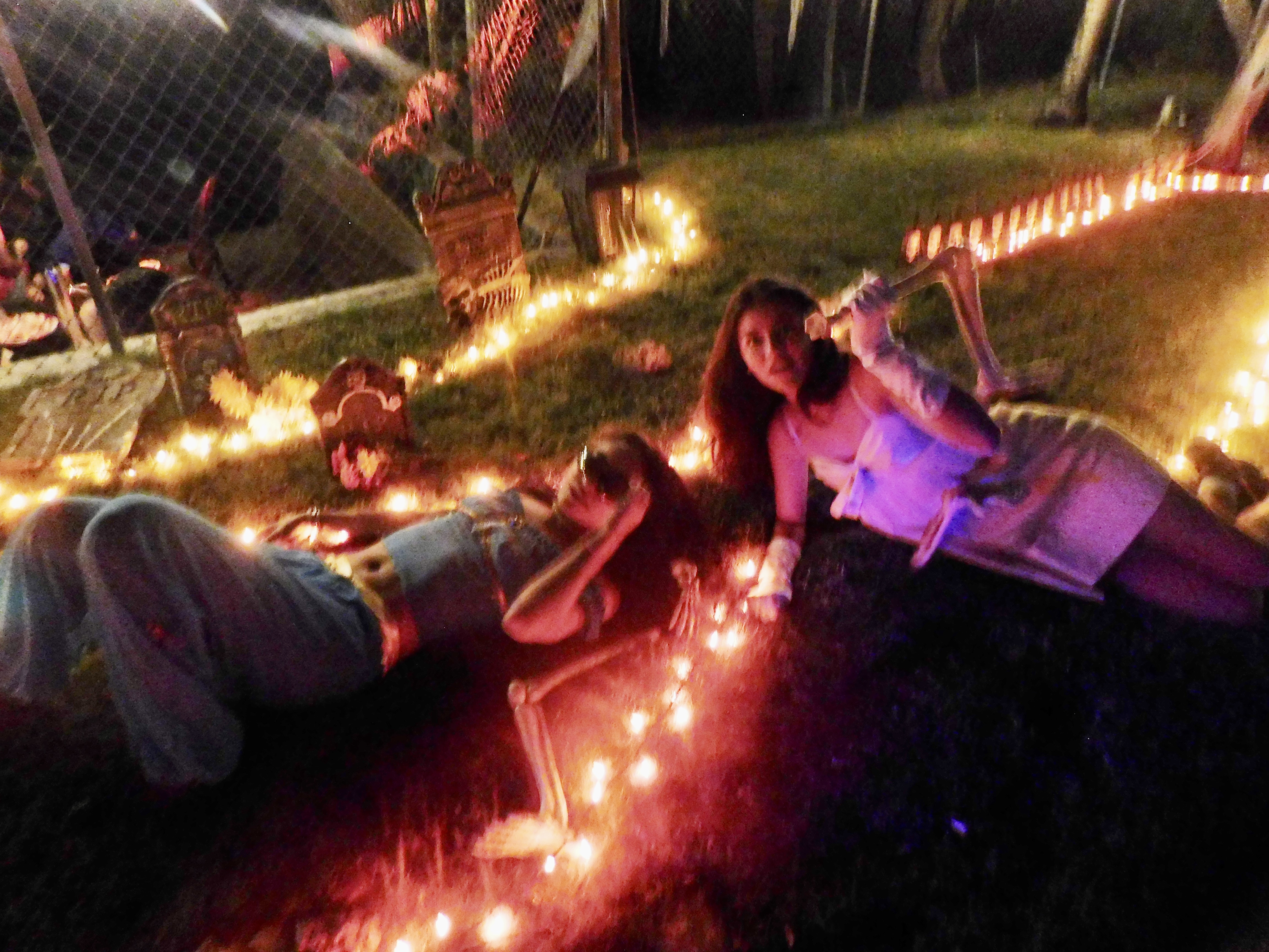 two girls on lawn dressed up for halloween
