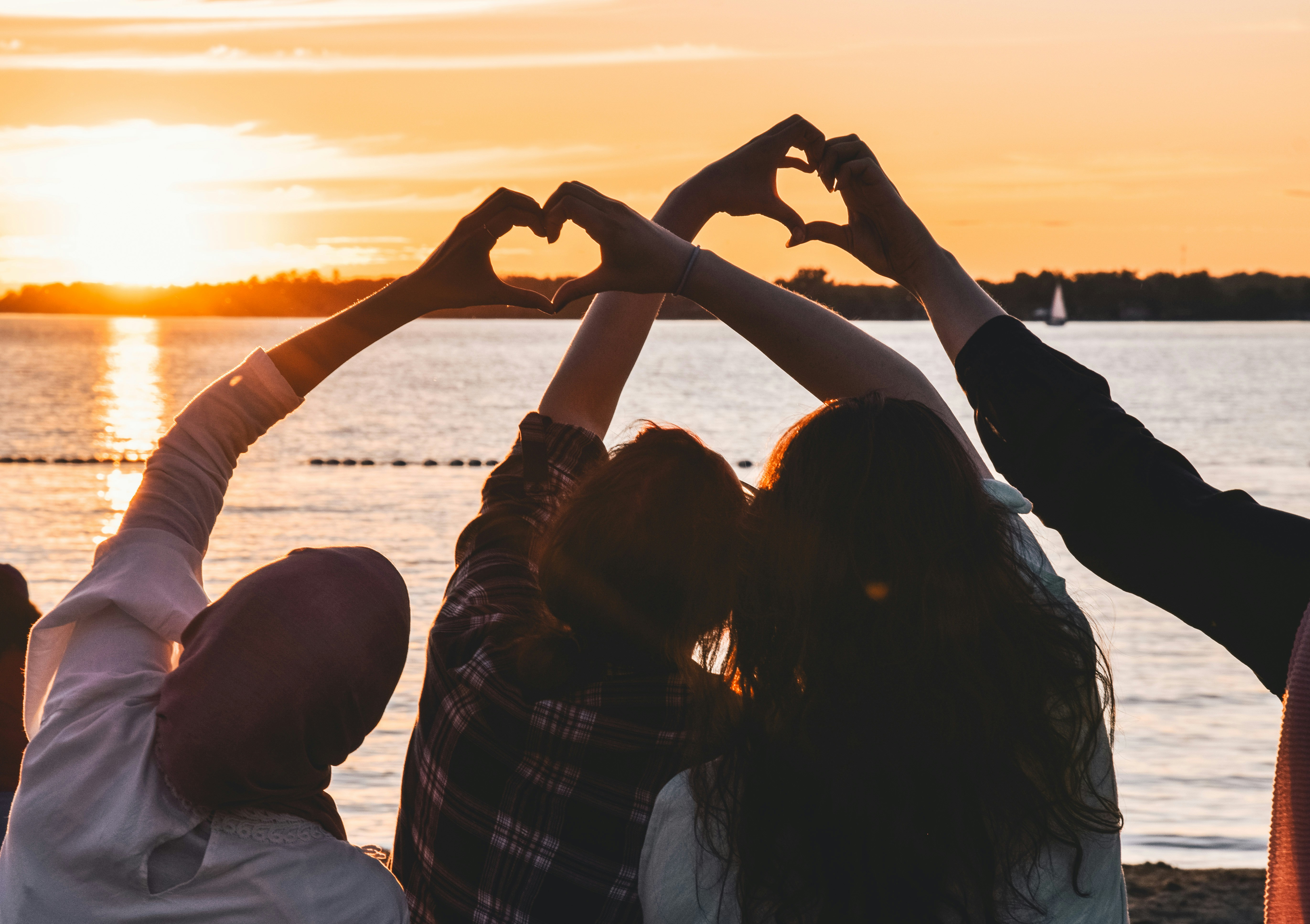 friends with heart handsjpg by Unsplash?width=698&height=466&fit=crop&auto=webp&dpr=4