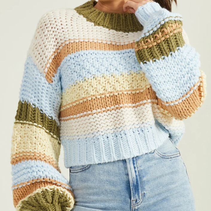 green, blue, and creme sweater