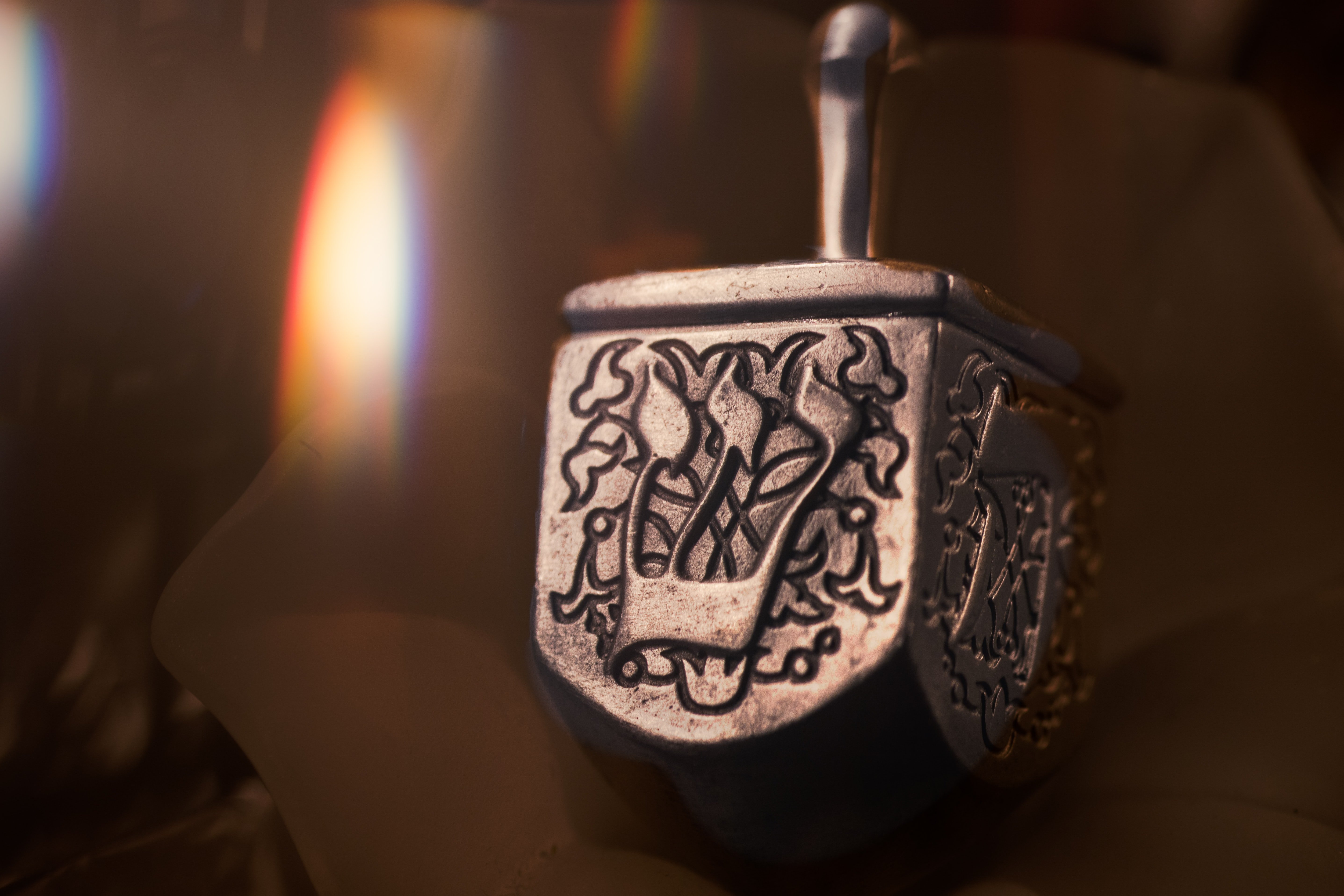 silver dreidel by Robert Zunikoff on Unsplash?width=698&height=466&fit=crop&auto=webp&dpr=4