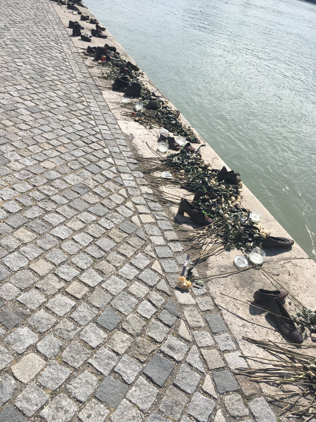 Boots sitting along the Danube to represent those who passed there, Budapest, Hungary