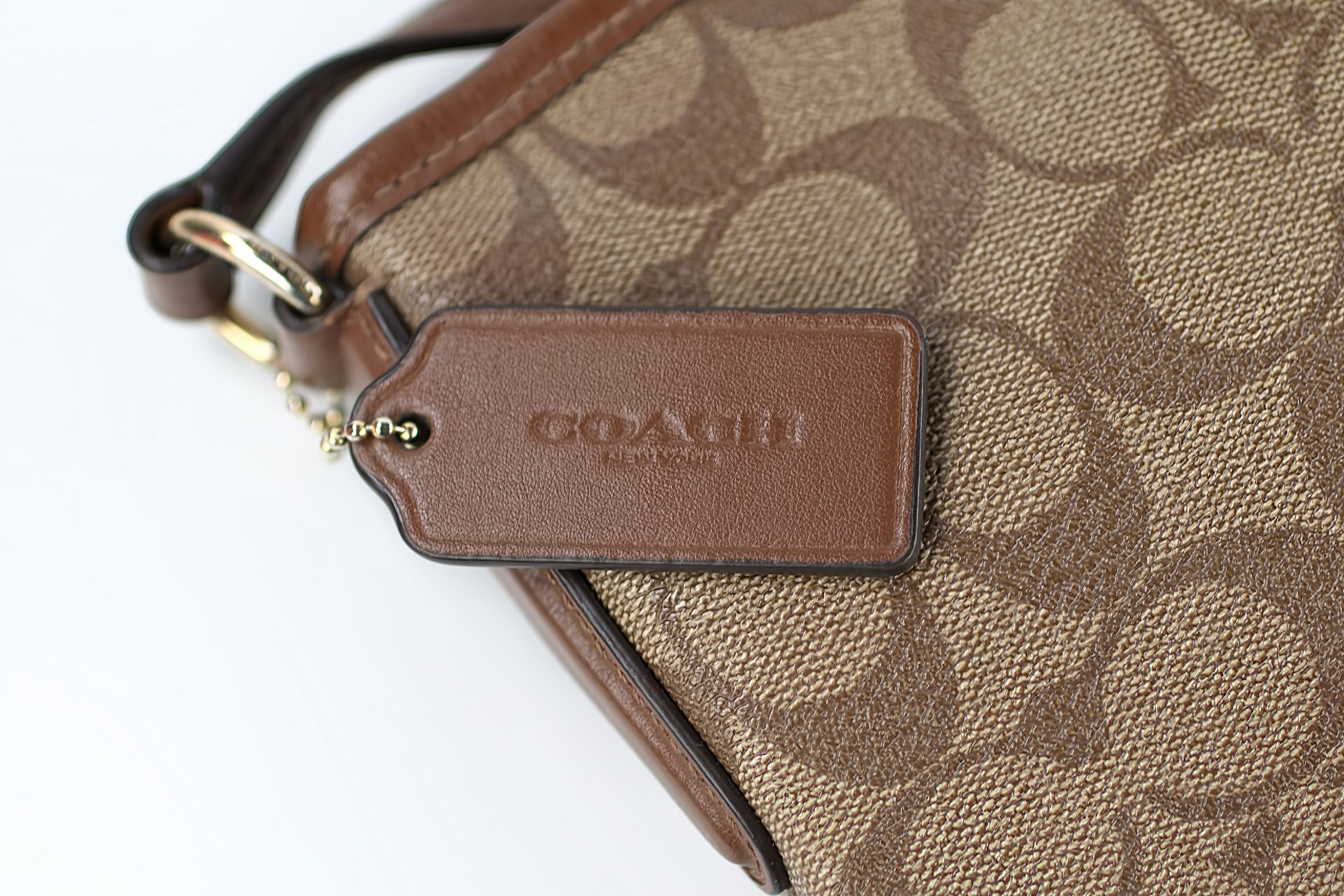 Close up of brown coach purse