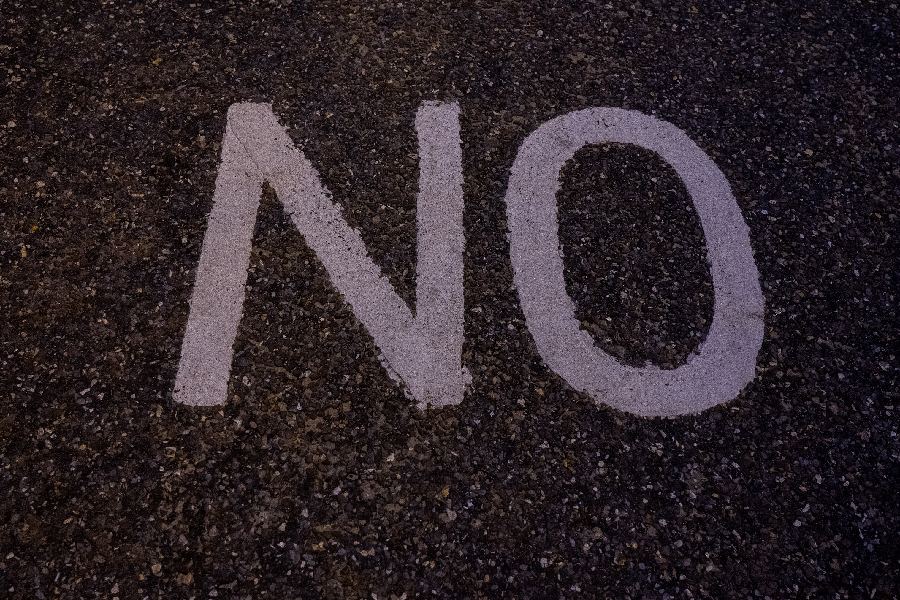 NO written on concrete by Unsplash