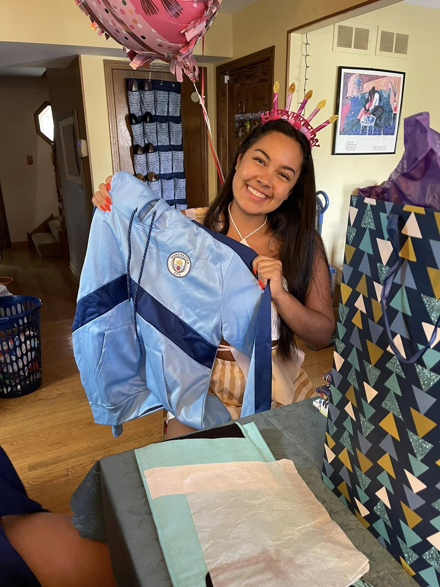 Picture of myself holding up Man City merch I got for my 18th birthday