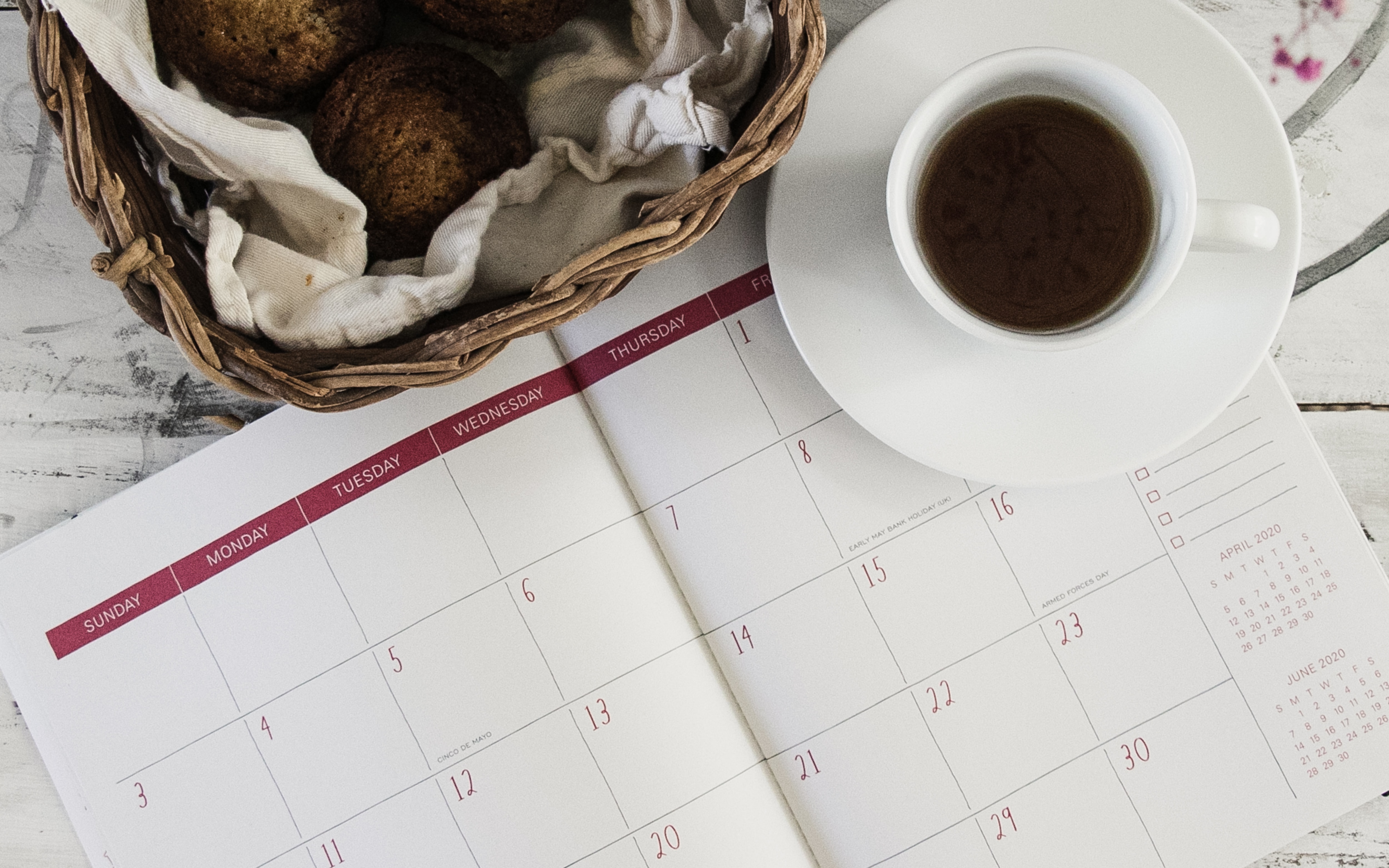 coffee mug near calendar