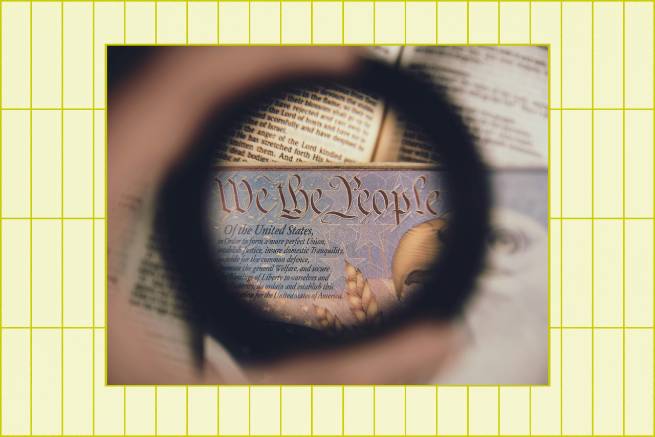 glass magnifying \"We the People\"