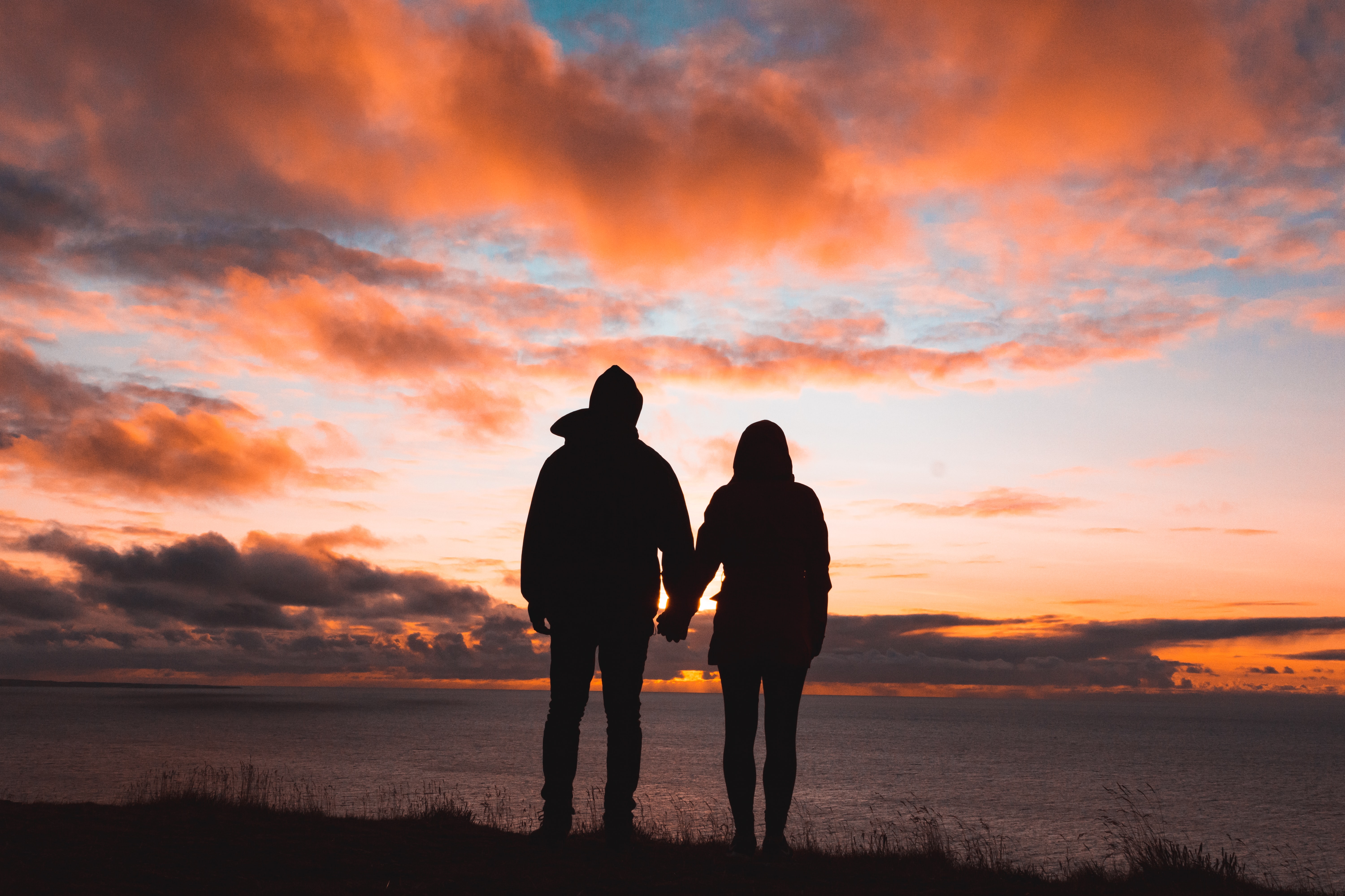 Couple holding hands at Sunset by Unsplash?width=698&height=466&fit=crop&auto=webp&dpr=4
