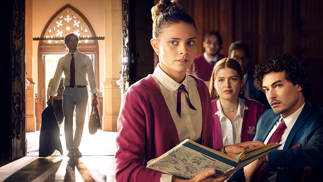 Man entering a room and three other people looking