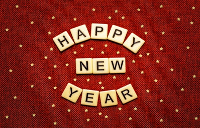 red background with stars, tiles read happy new year