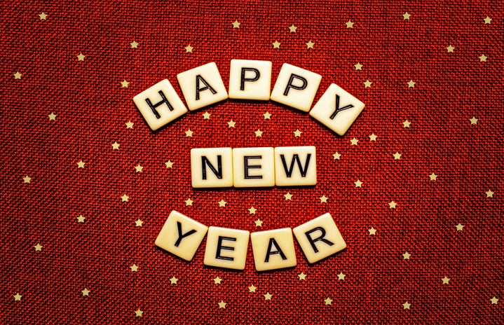 red background with stars, tiles read happy new year