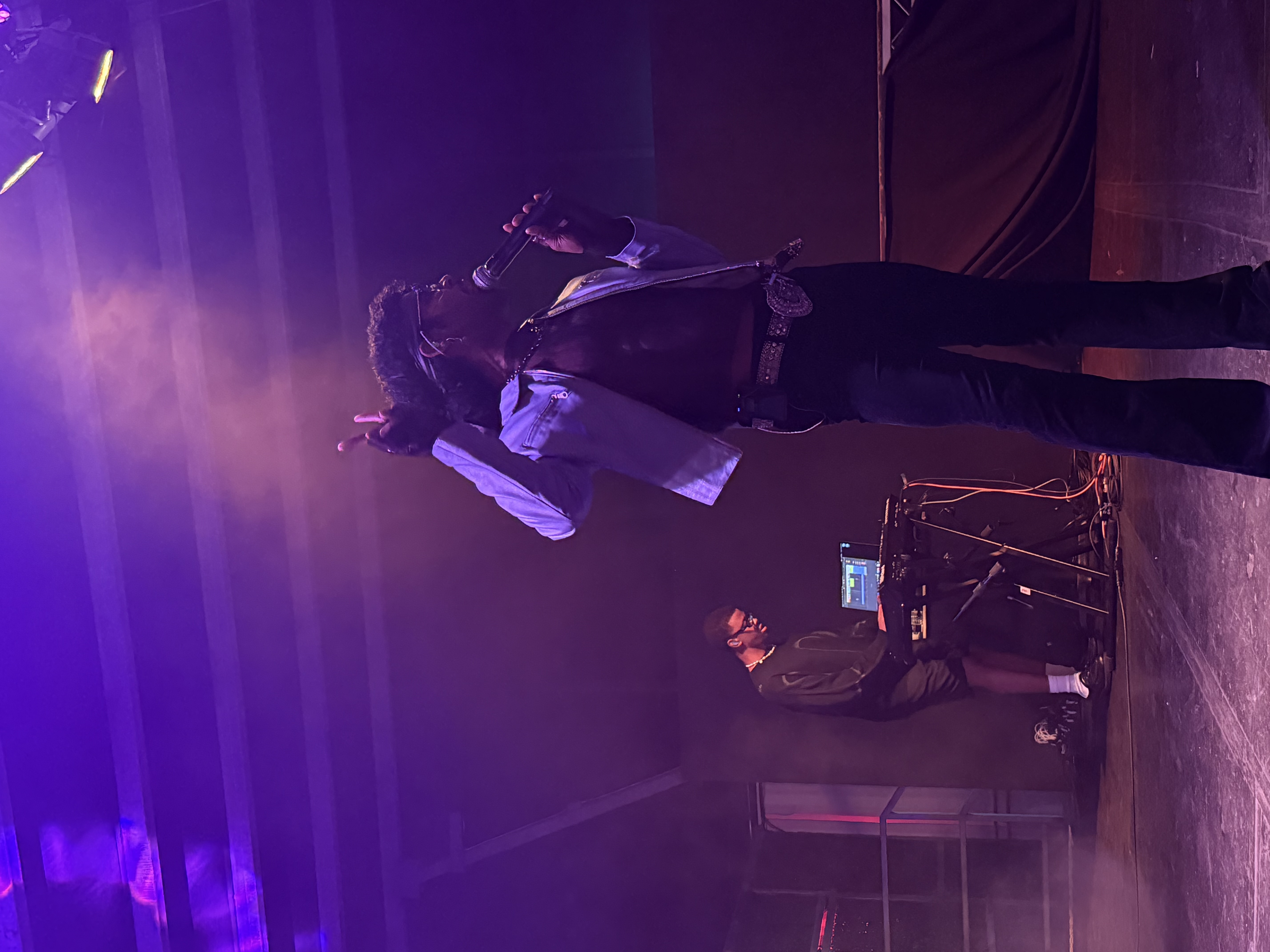 Kyle Dion, music artist, performing on stage at a concert