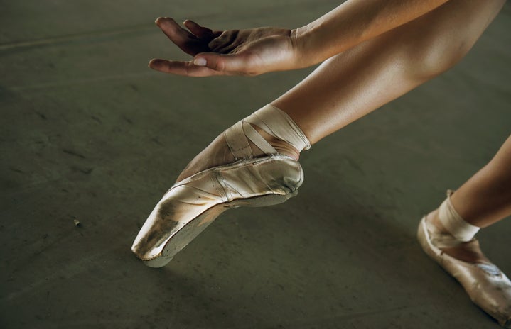Foot in ballet pointe shoe