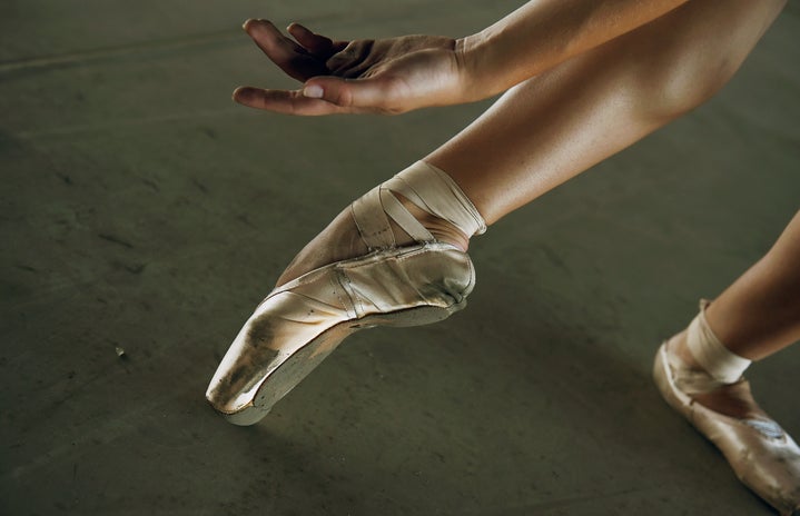 Foot in ballet pointe shoe