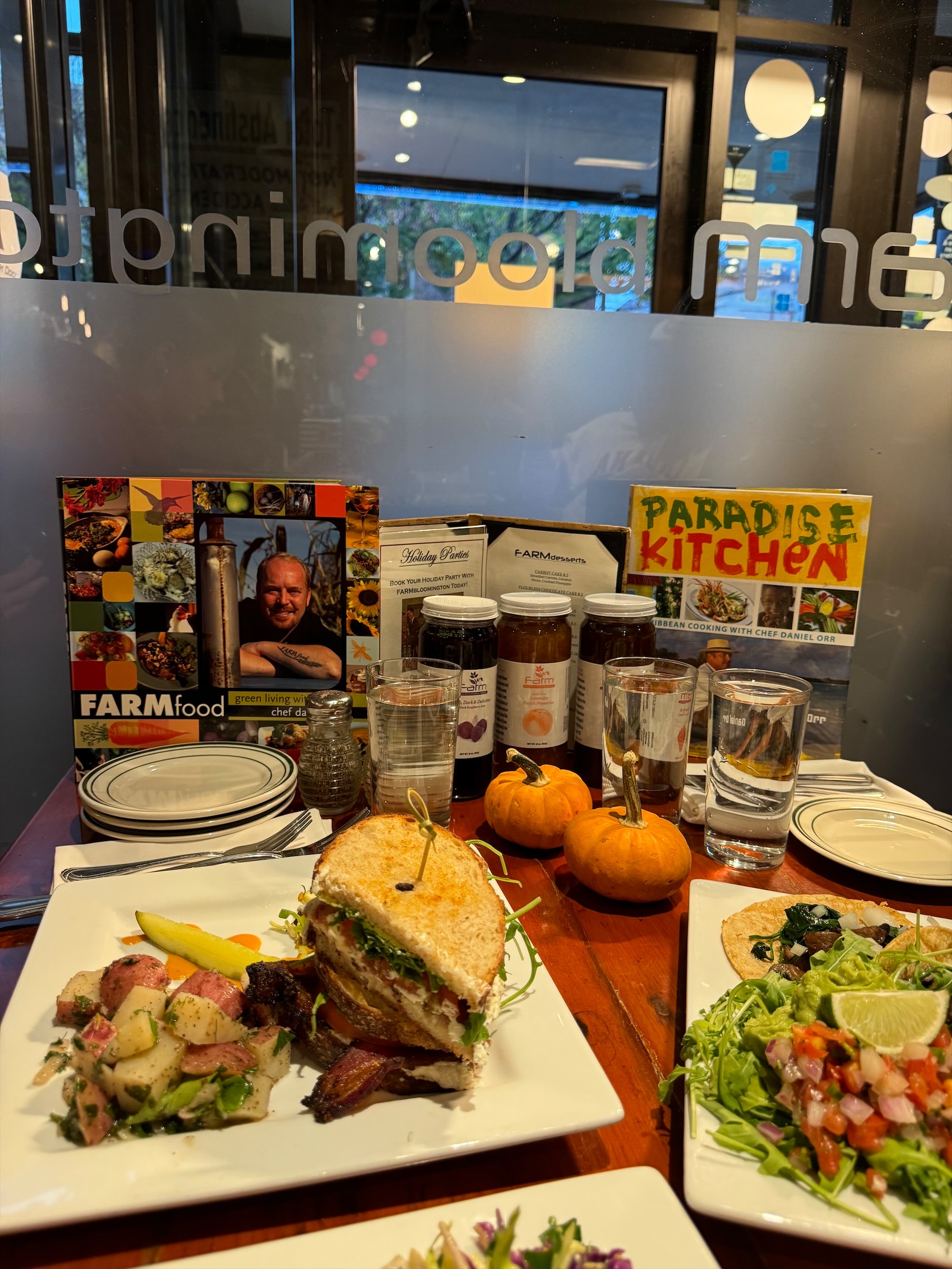 Book written by the chef of FARM Bloomington with food in the foreground