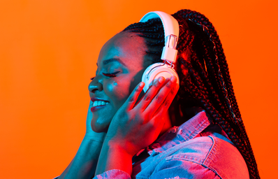 A Black women listening to music