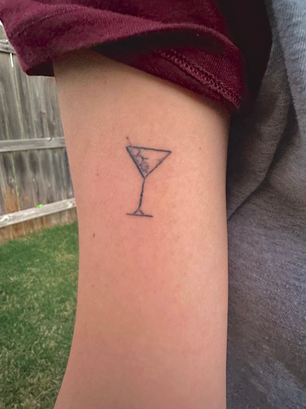 martini glass on right upper bicep