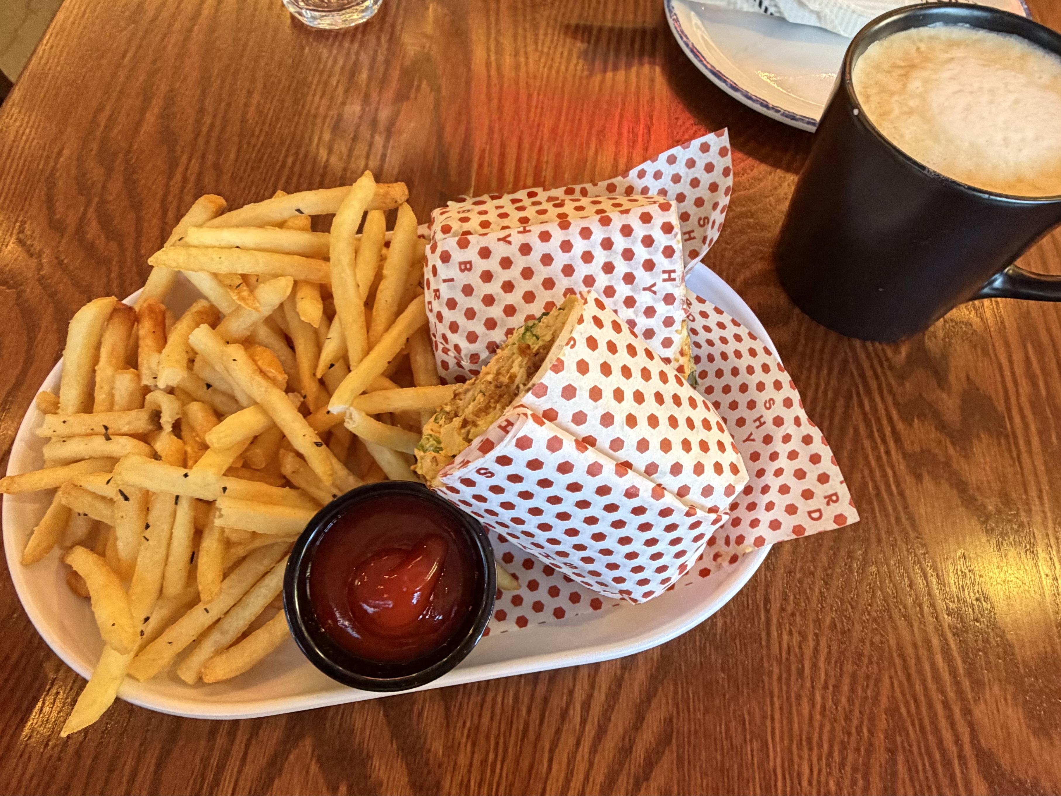 Chicken wrap with french fries and hot latte