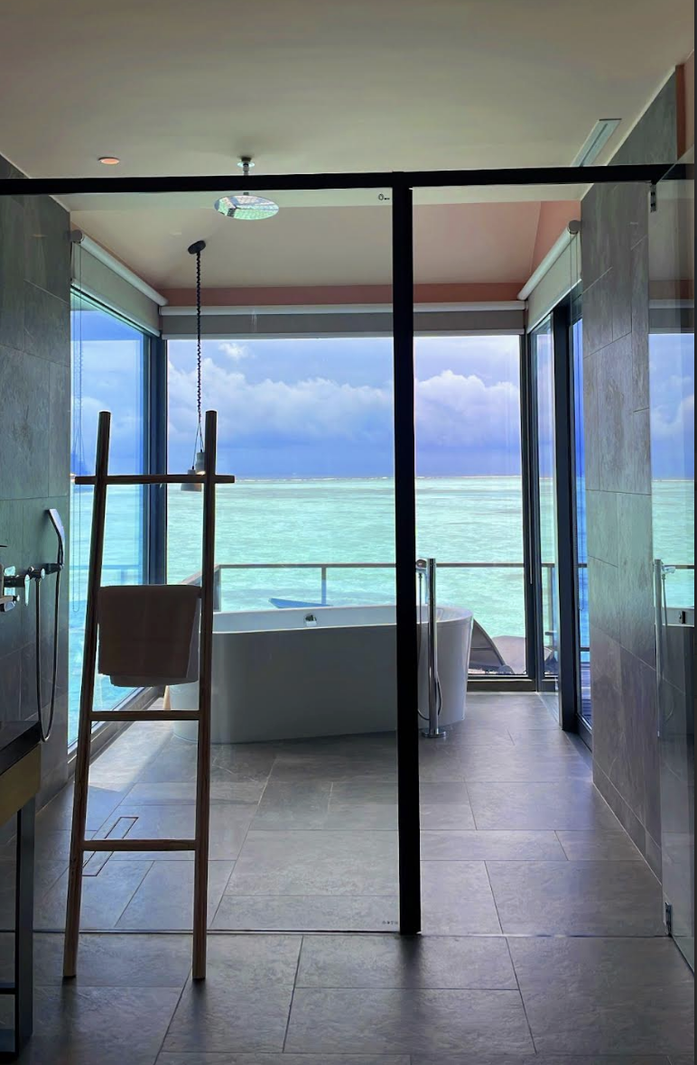 View of the ocean from the inside of a room