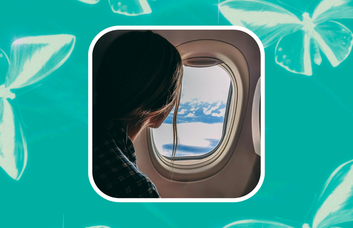 girl looking out plane window