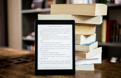 ebook in front of stack of books