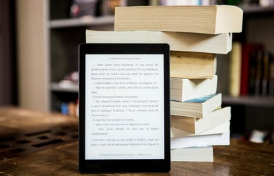 ebook in front of stack of books