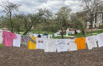 Picture from the Clothesline Project showing t-shirts hung up across Mckeldin Mall