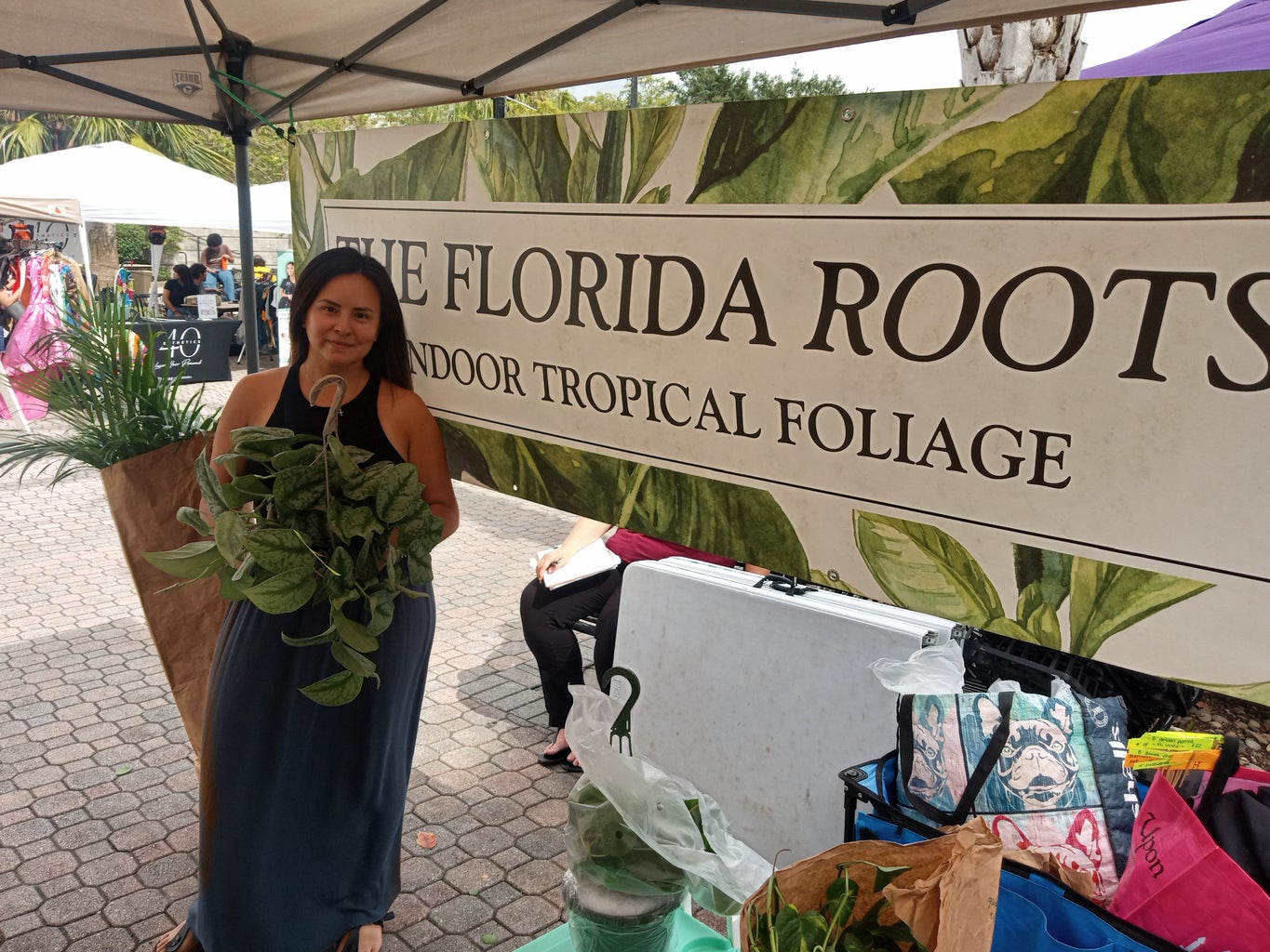 original photo of The Florida Roots and Greenery storefront and owner