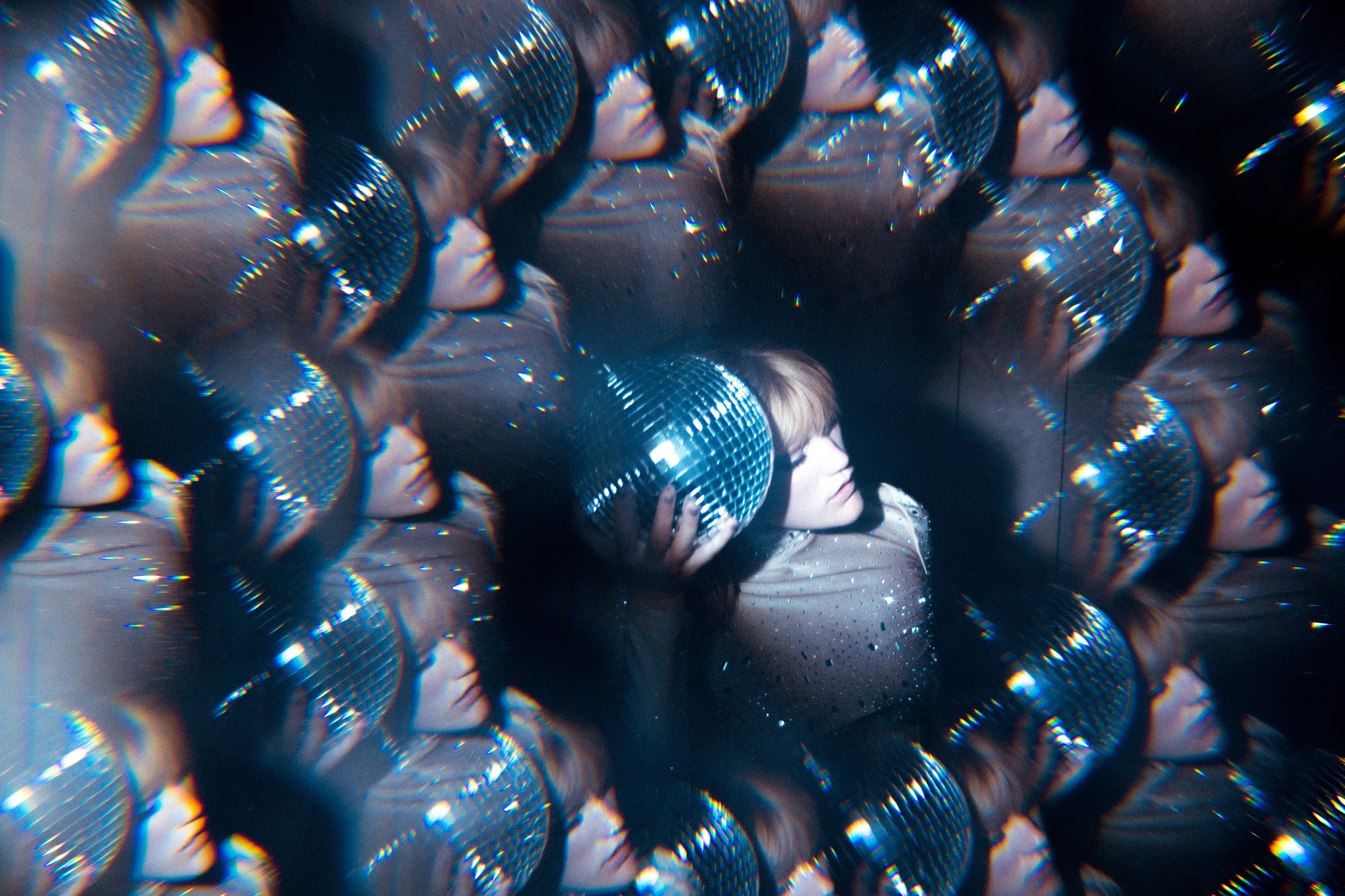 Women holding disco ball