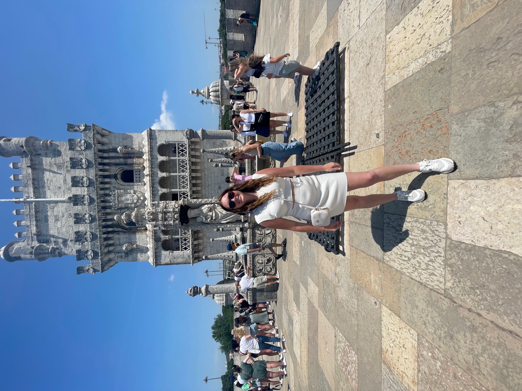 woman standing in front of the Belem Tower
