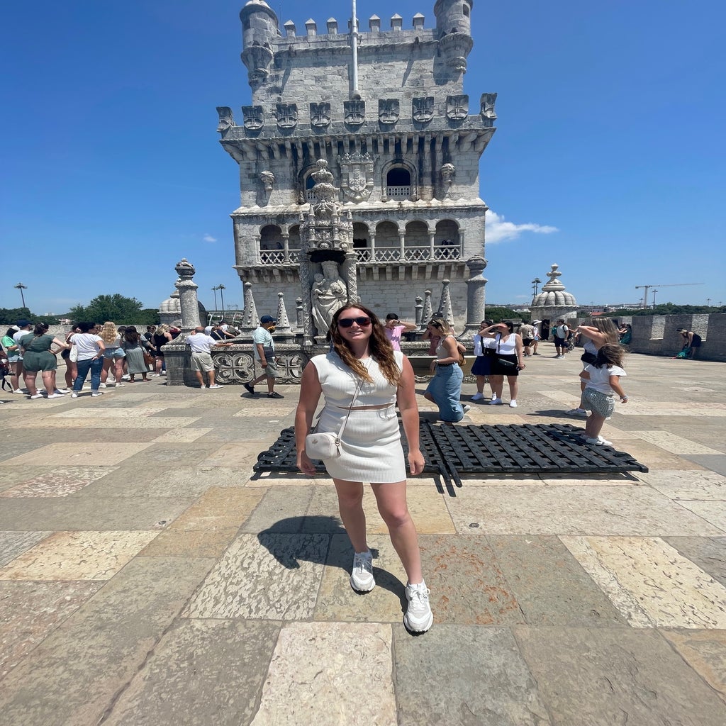 woman standing in front of the Belem Tower