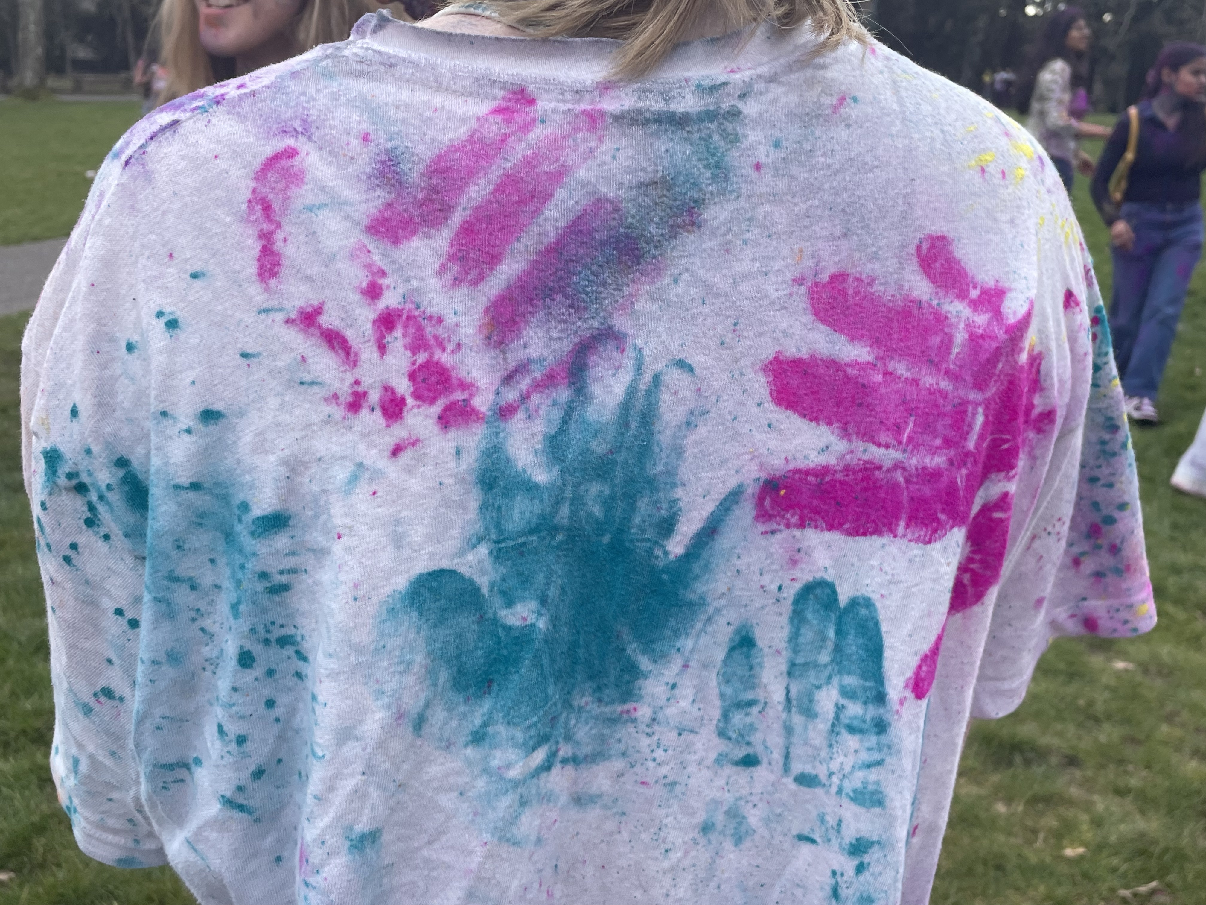 colourful handprints on white tshirt