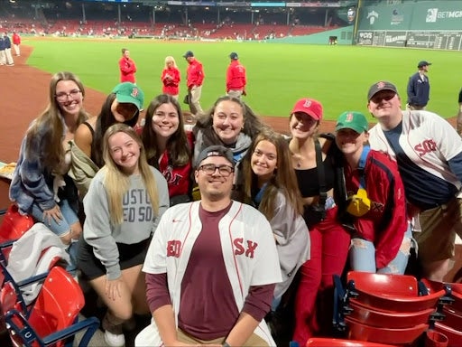 A group of Emmanuel College students at Fenway Park for the Red Sox game after Mary Boyd\'s Inauguration