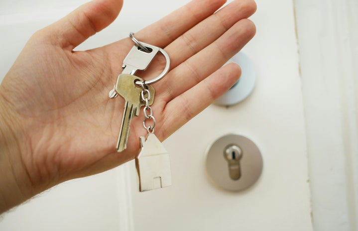 hand holding house keys
