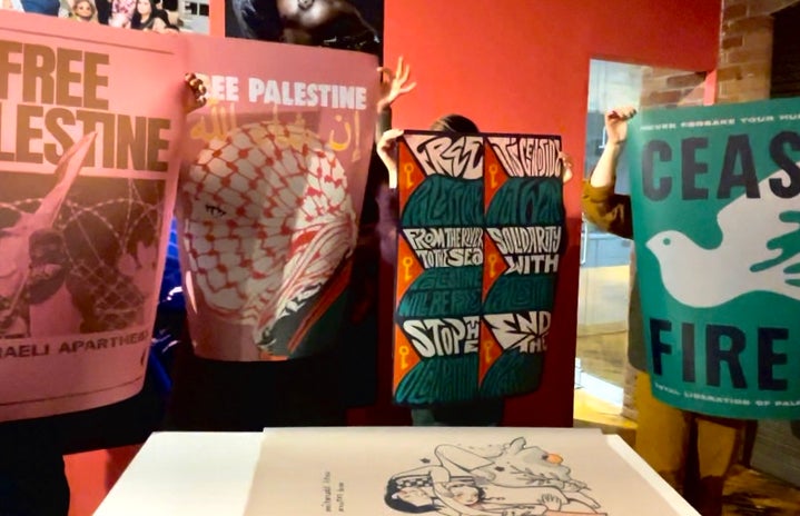Posters at a postering event for the Palestinian cause, spreading awareness.