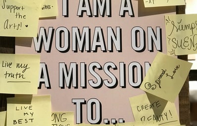 Sticky notes of women empowerment on a wall