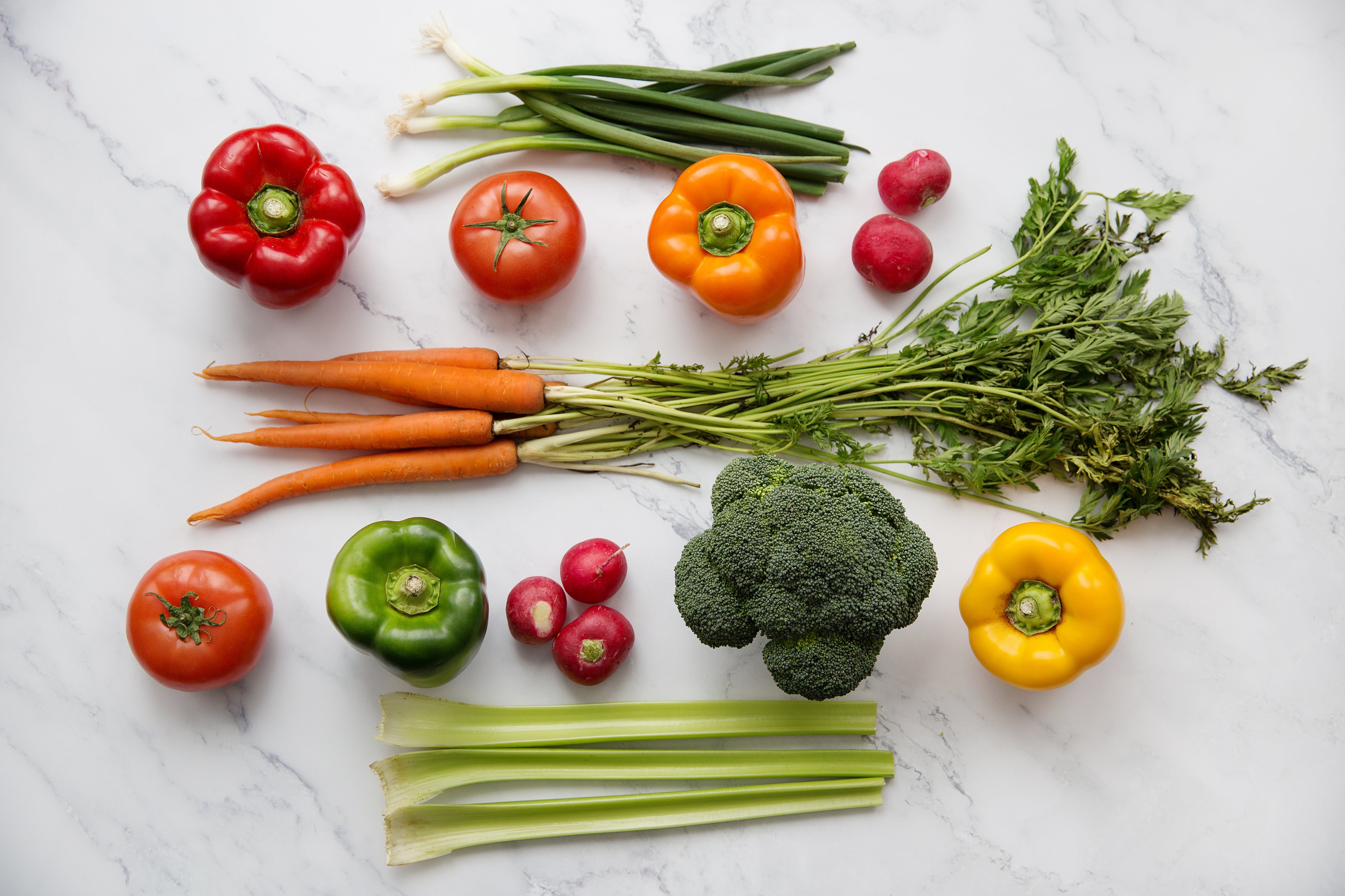 Flatlay photo of vegtables on marble countertop